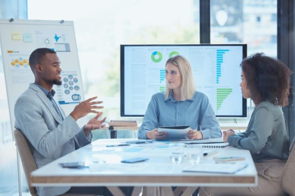 Business meeting talking about strategy, sales and developing of the future of the company.  Success means achieving financial goals through teamwork, corporate strategy and ambitious planning skills.